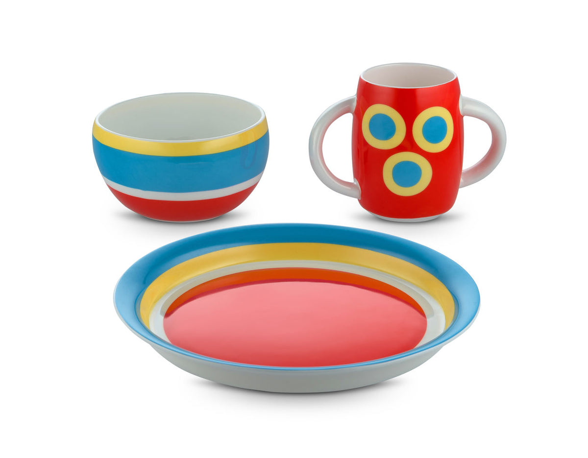 Alessi Alessini kinder servies met bord, kom en beker in rood, blauw en geel.