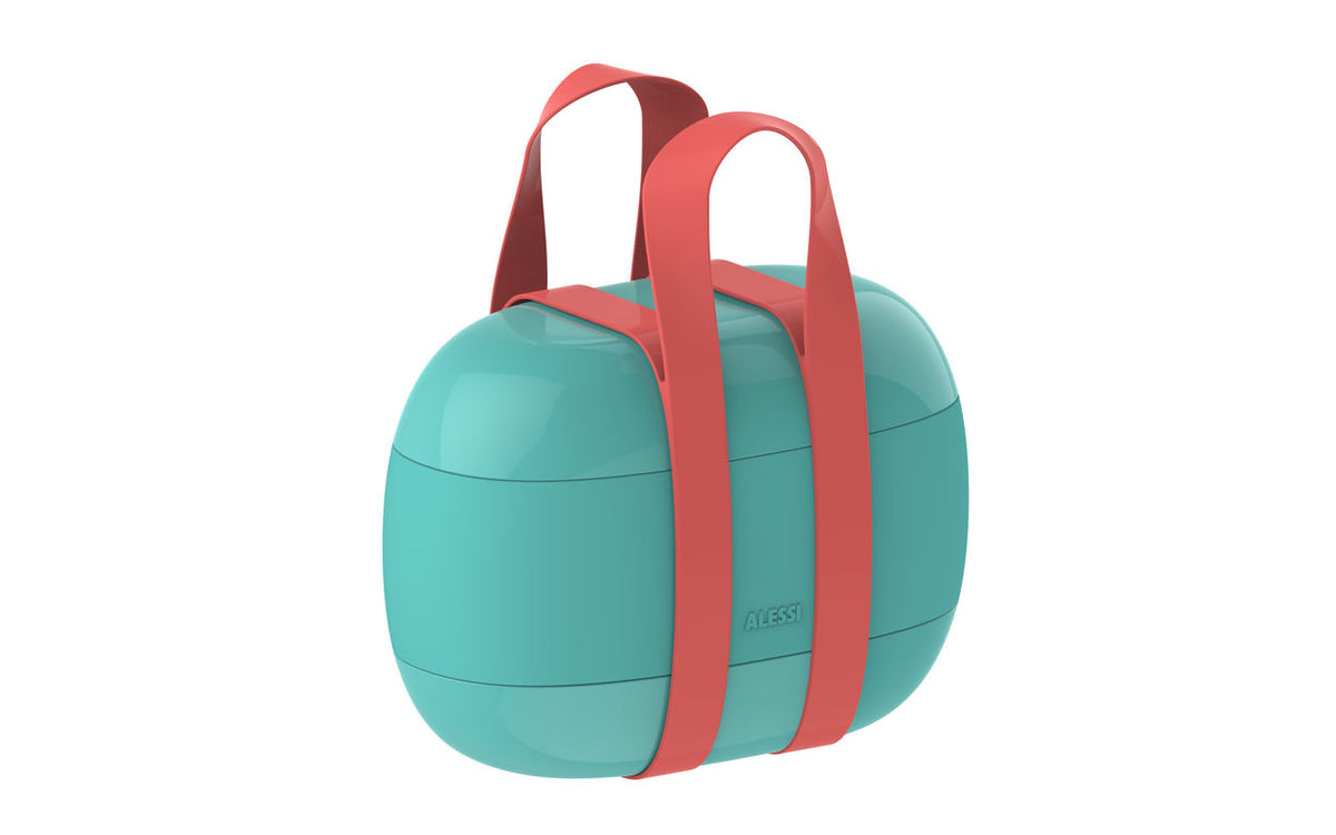 Alessi bento-box in blauw met rode draagband, schuin aanzicht