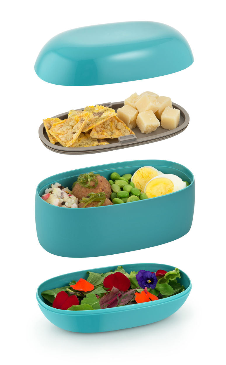 Alessi bento-box in blauw, uiteengelegde vakken met deksel