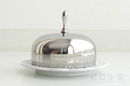Alessi DRESSED botervloot met porseleinen schotel en glanzende metalen deksel