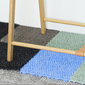 Shiba doormat tiles by Tidy in multiple colours side by side in use