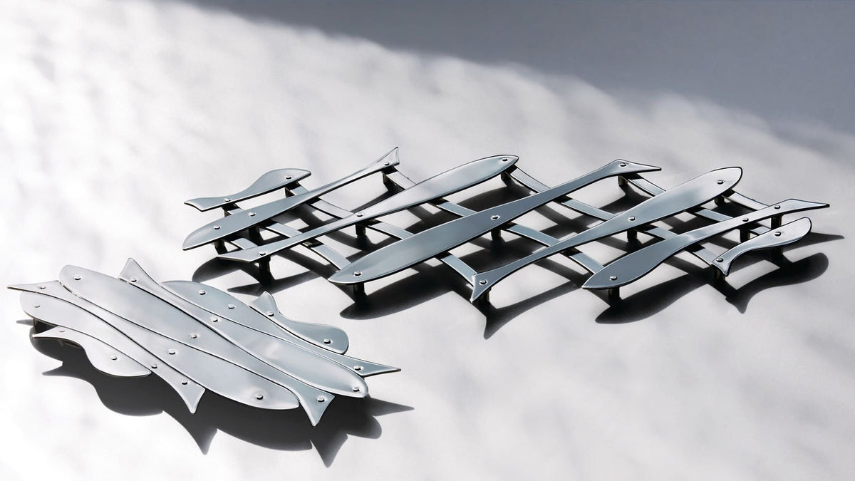 Alessi Pescher onderzetter, ontwerp D'Urbino Lomazzi, uitgeschoven naast opgevouwen staat