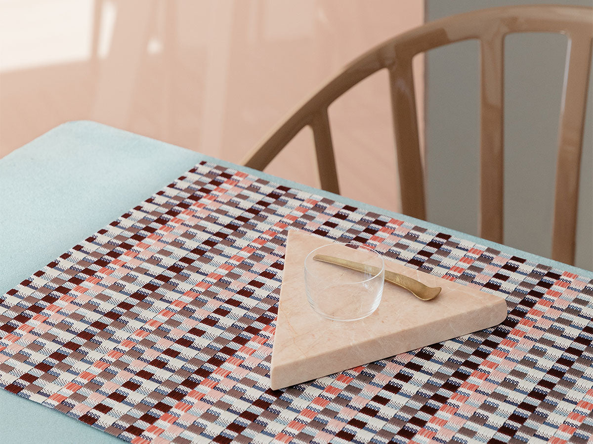 Heddle Dogwood placemat, designed by Sandy Chilewich, in use with marble board