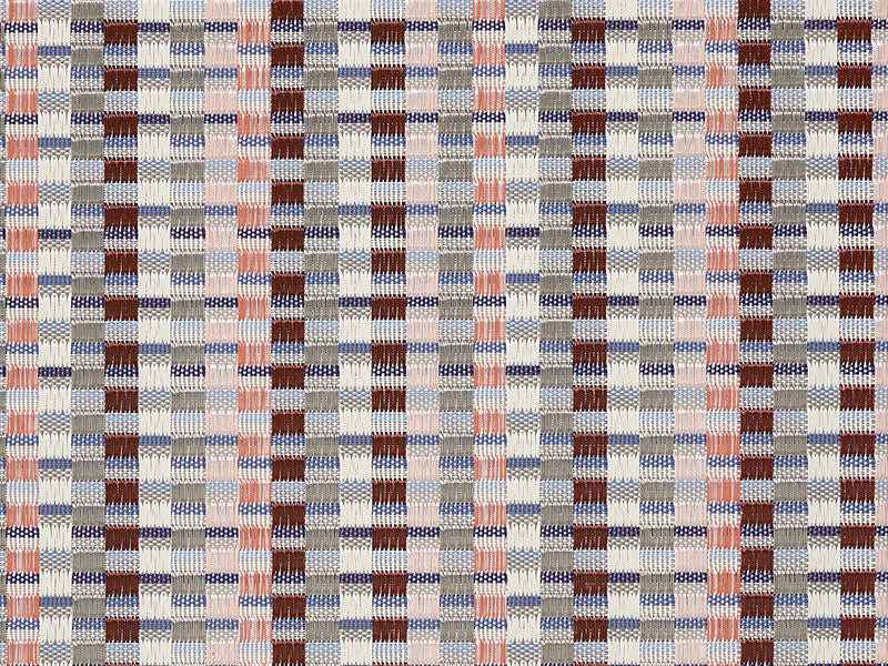 Detail van het geweven patroon van de Heddle Dogwood placemat, in rood, koraal en blauw