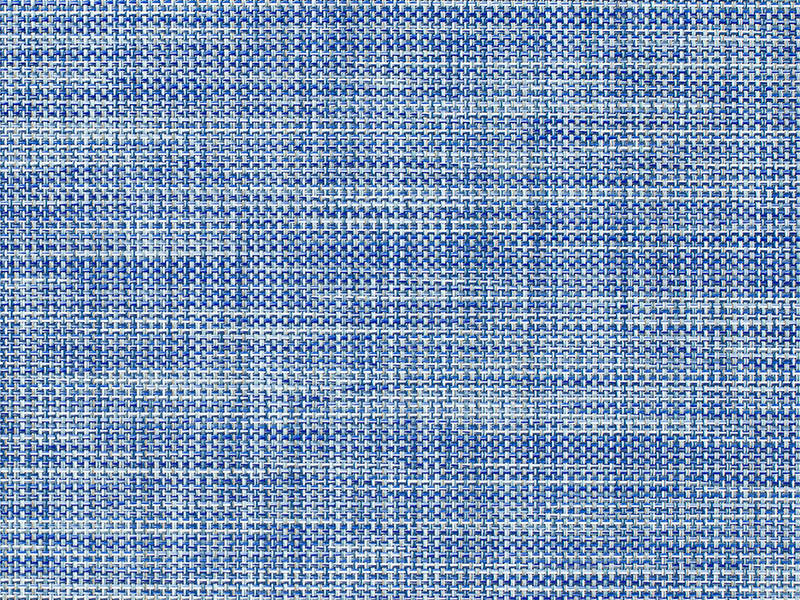 Detail of the woven pattern of the ovale placemat by Sandy Chilewich in blue tones