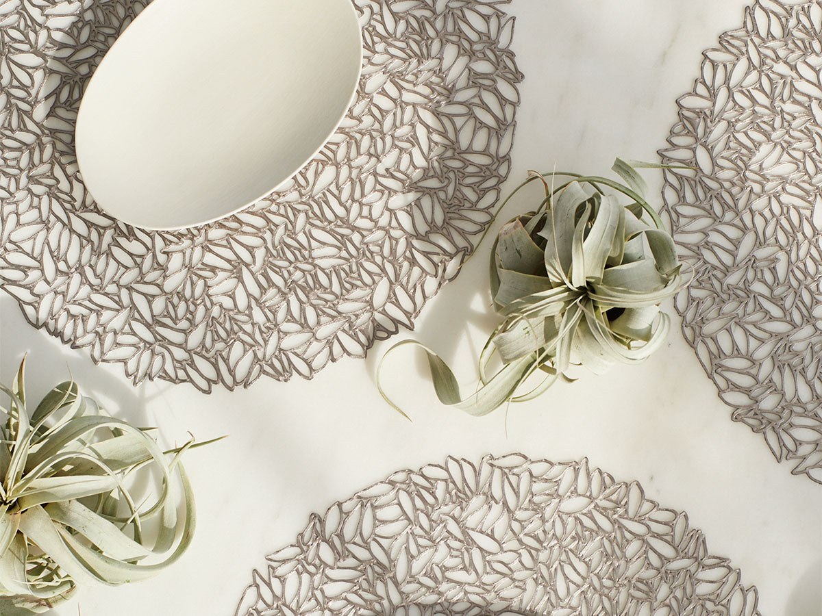 Multiple Chilewich Petal placemats in gunmetal, laid out separately side by side