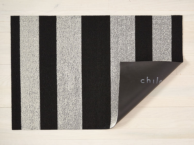 Chilewich doormat black-white striped, corner folded showing bottom