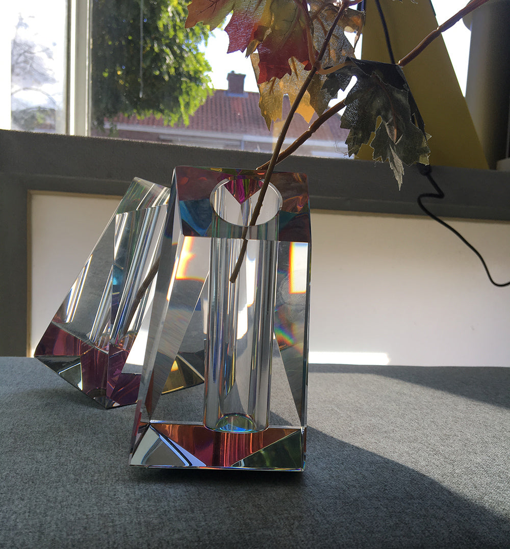 Two crystal Regenbogen vases by Fundamental side by side, with branches