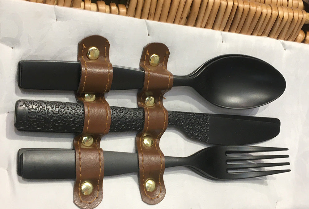 Alessi Dressed En Plein Air cutlery set in black melamine, in leather cutlery holder