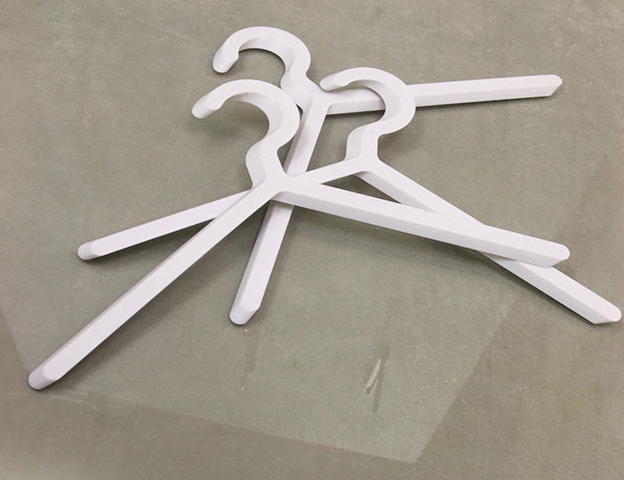 Alessi Illusion Set White coat hangers, three pieces laid separately, white plastic