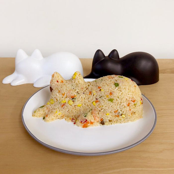 Neko sand mould cat used for a rice dish, next to the black and white shape