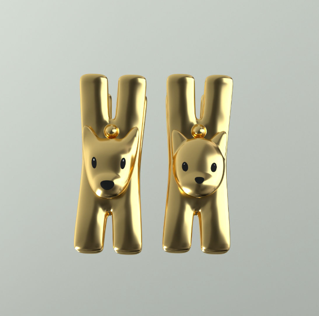 Alessi Lampo en Giampo clips in goud, los verkrijgbaar als kat en hond