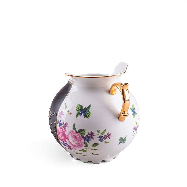 Seletti LFE vaas uit de Hybris-serie, wit met bloemmotief en gouden handvat, zwarte zijde deels zichtbaar