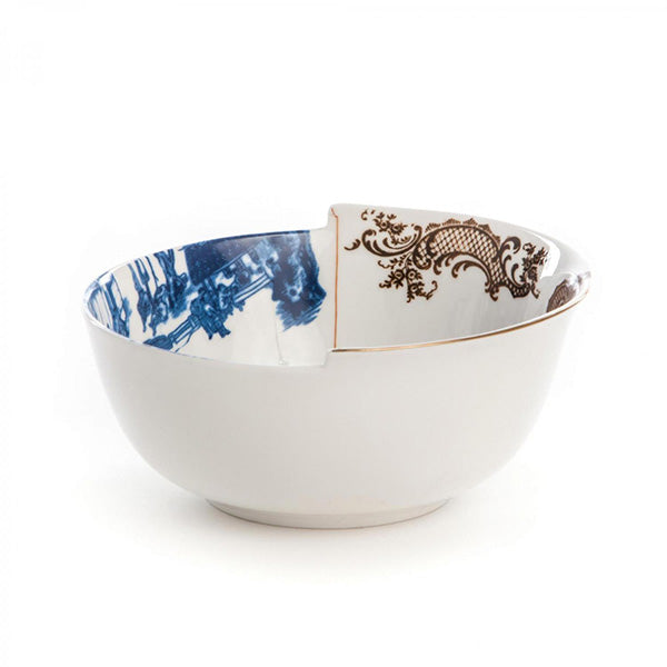 Alessi Hybrid Despina bowl, design CTRLZAK, from the Mooi van Seletti series, at an angle view with blue and gold motif