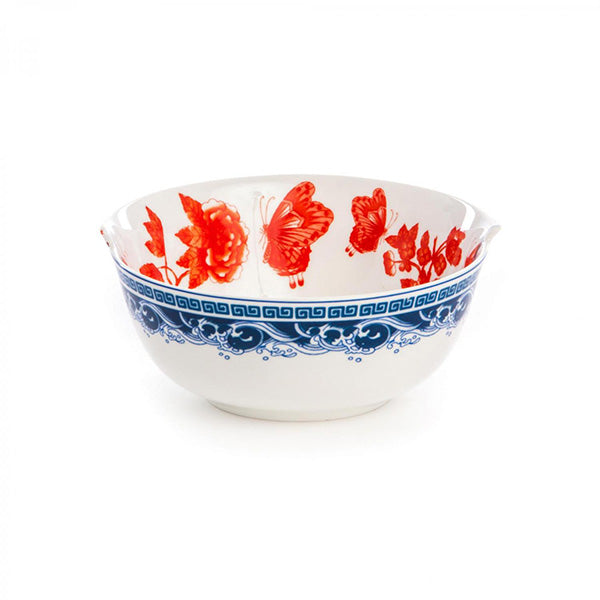 Kom met rode vlinders en blauw golfmotief, detail van de rand.