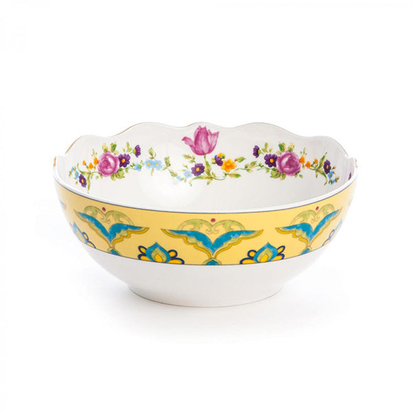 Seletti Hybrid Bauci bowl, front view with floral motif and blue-green figures on yellow strap