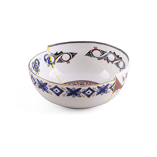 Bowl with asymmetric seam between two patterns, in blue and black-and-white eye motif