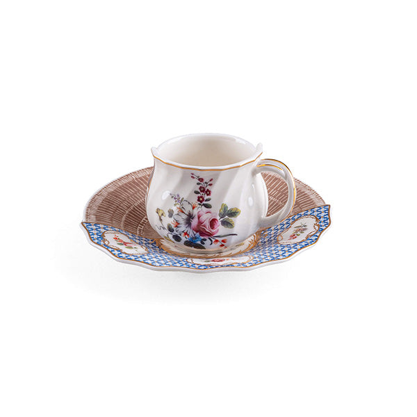 Djenne coffee cup with pink floral motif, saucer in brown woven pattern