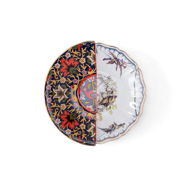 Saucer from the Hybrid series, with floral and bird pattern transitioning halfway