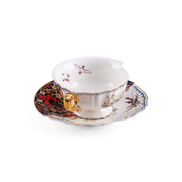 Teacup and saucer, front view with wavy rim and gold handle
