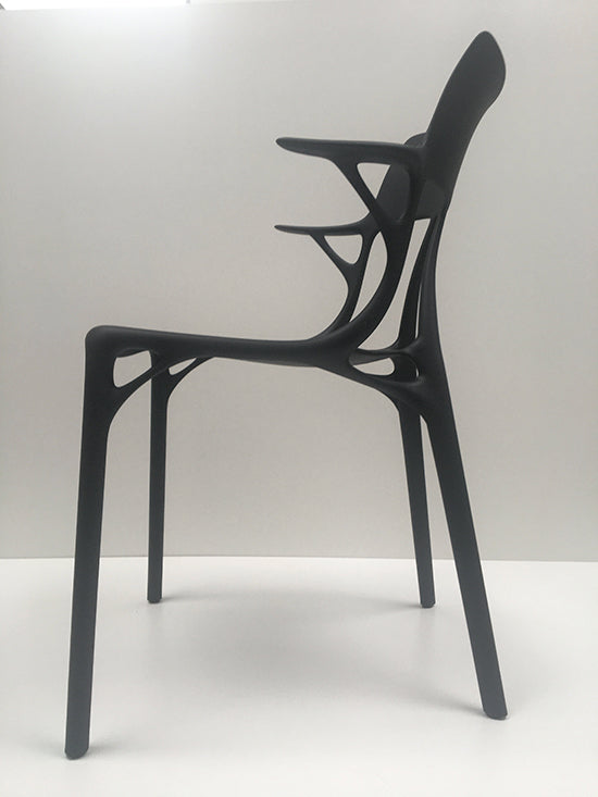 Kartell A.I. chair by Philippe Starck in matt black, side view