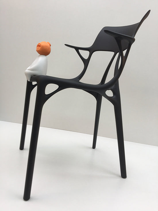 Kartell A.I. chair by Philippe Starck, matt black, three-quarter rear view