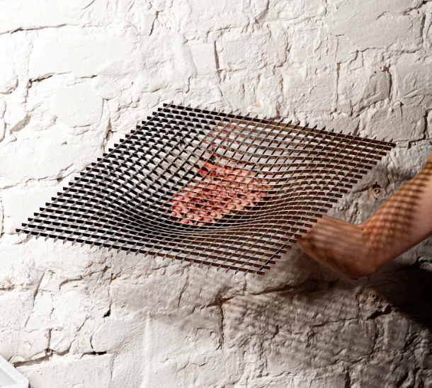Stainless steel Gravity fruit bowl by Fundamental in use, held in hand