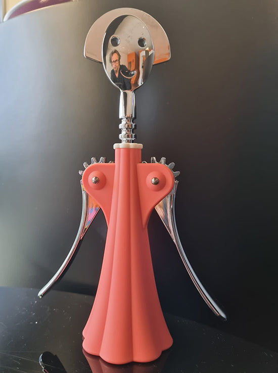 Anna corkscrew by Mendini in coral pink, side view with arms open