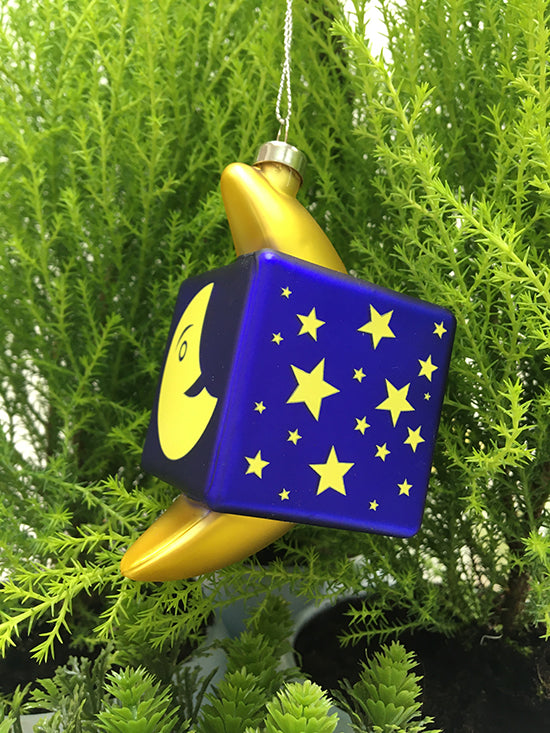 Alessi Mooncube kerstkubus in glas, zijaanzicht met sterrenmotief, blauw en geel
