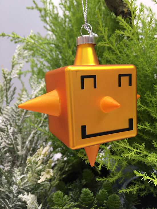 Glazen kerstbal Cubic-Star van Alessi, kubusvorm met gezicht, in oranje, ontwerp Giacon en Jori