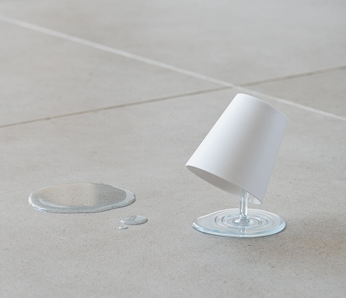 Japanese Oh!! bathroom tumbler on stand, tilted at an angle on floor