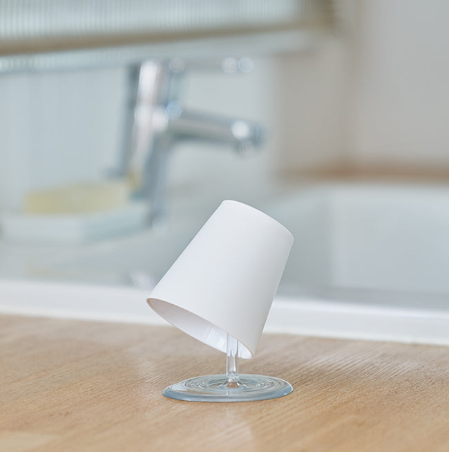 Beautiful Oh!! bathroom tumbler on washbasin, tap in background