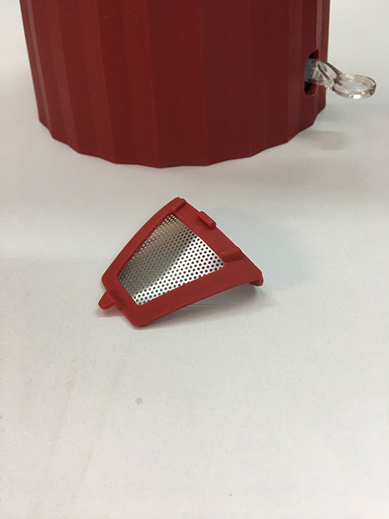 Alessi Plissé kalkfilters in rood, uitneembaar, met kan op achtergrond