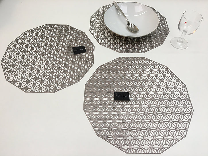 Chilewich Kaleidoscope placemat, designed by Sandy Chilewich; last set of 3, twelve-sided in gunmetal