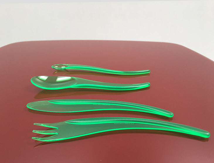 Alessi Zlin bestekset met mes, vork, lepel en longdrink lepel in groen kunststof