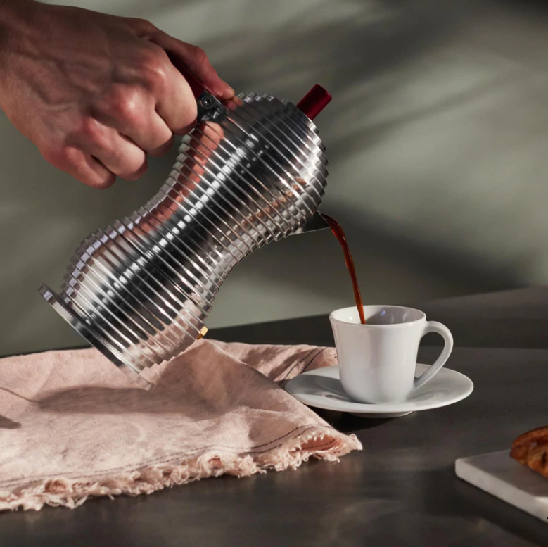 Alessi Pulcina 3-cup espresso maker for induction, coffee pouring into cup