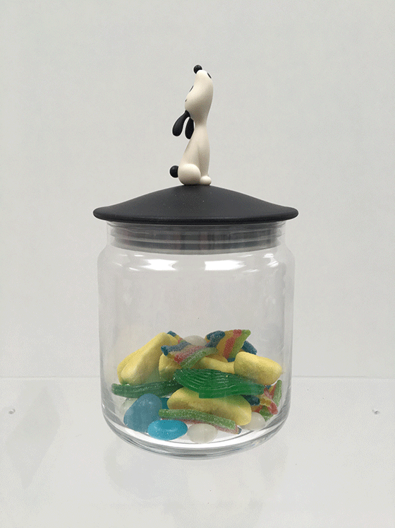 Glass sweet jar with dog figure on lid, filled with sweets