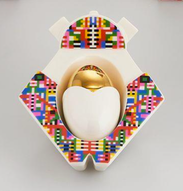 Holyhedrics Christmas figure by Alessi, top view with gold egg-shaped element in crib