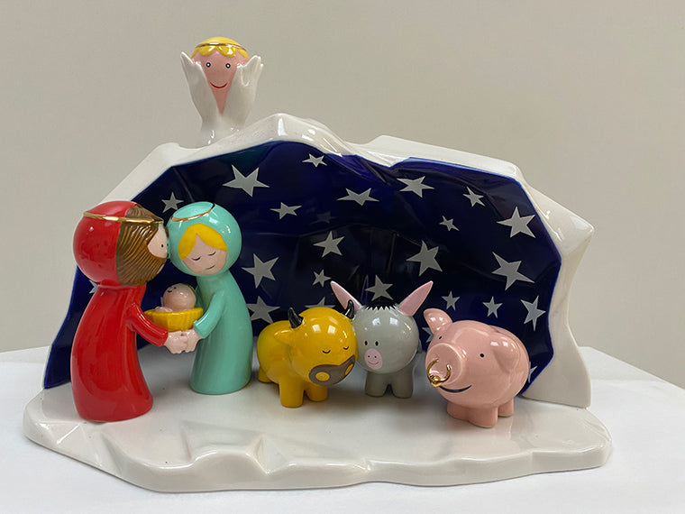 Alessi Geluksvarken Porca figurine next to nativity scene figurines from the happy Eternity collection