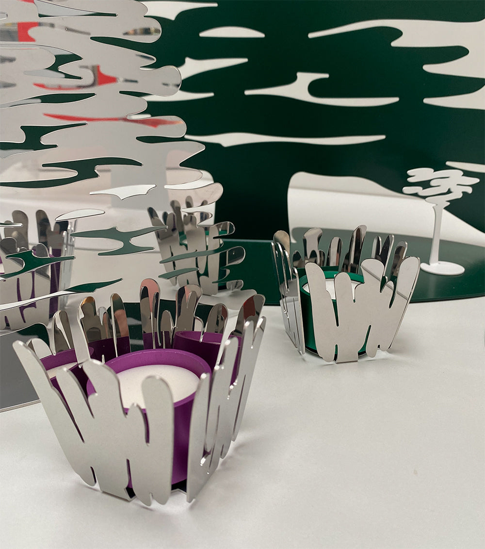 Two Barcandle candle holders side by side with green and purple tealight