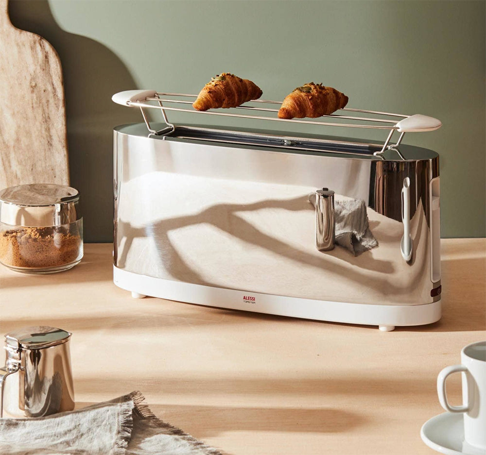 Alessi broodrooster met opzetstuk, gepolijst roestvrijstaal, met croissants op het rekje