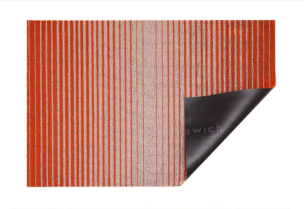 Domino-Apricot doormat folded over, showing black vinyl backing