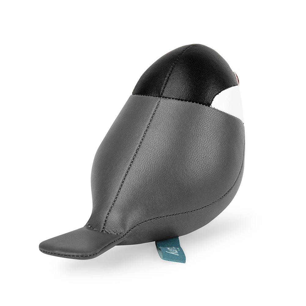 Achteraanzicht van de Zuny rijstvogel paperweight in zwart en grijs