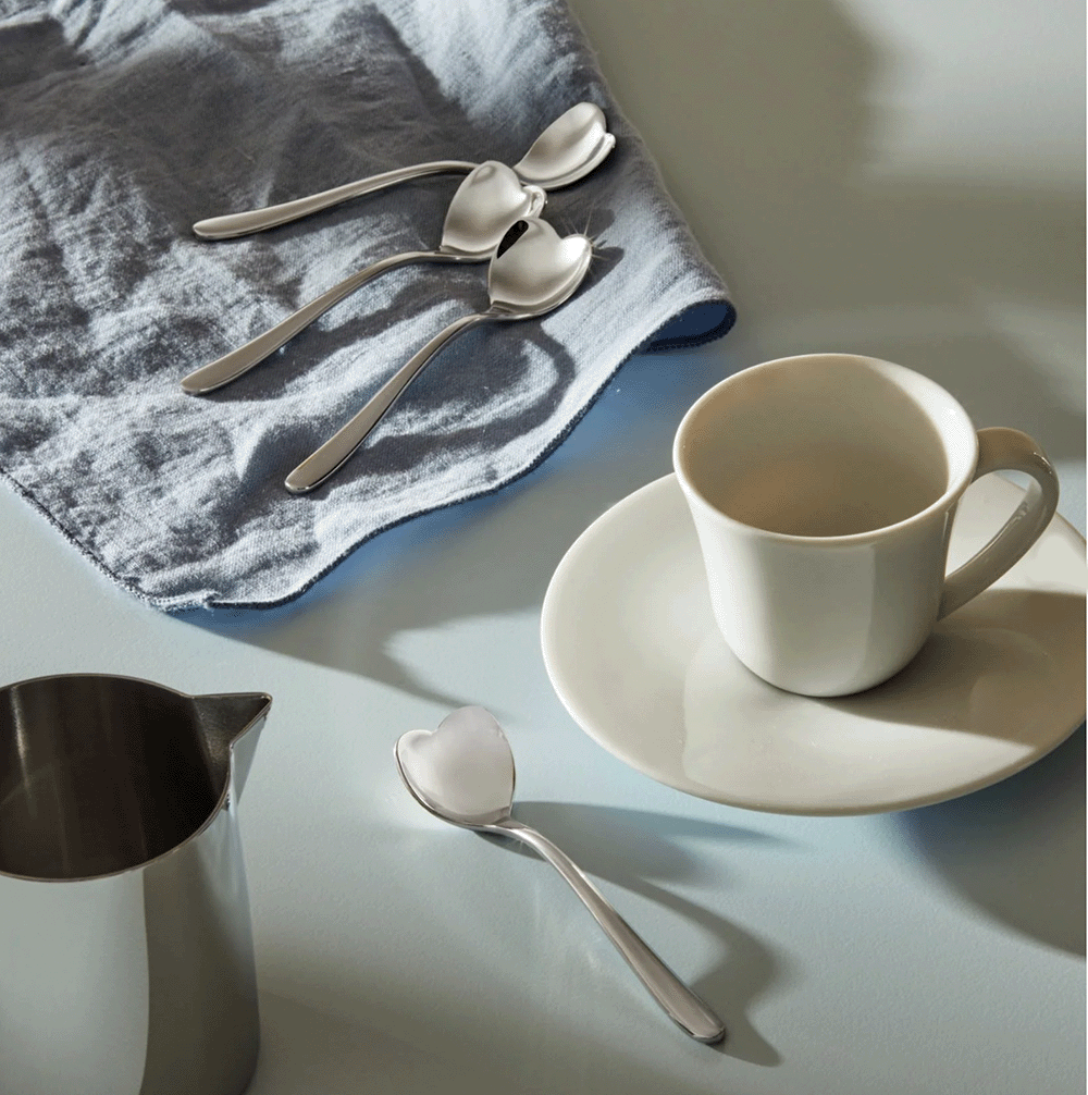 Alessi Hart mocha spoon, stainless steel, separate item next to cup and saucer