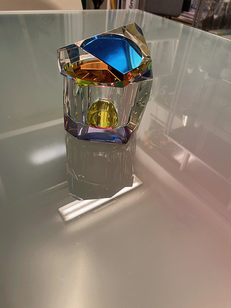 Regenbogen storage box by Fundamental, open, with blue and yellow light reflections