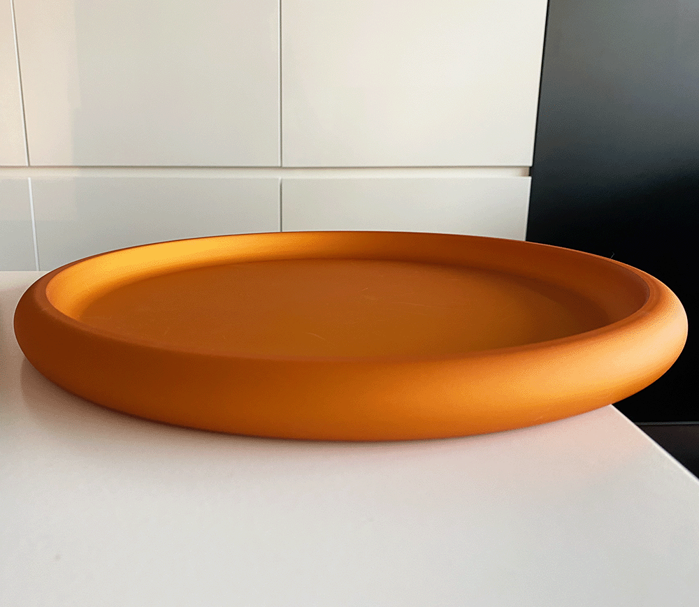 Discolo dienblad in oranje, zijaanzicht van de ronde schaal