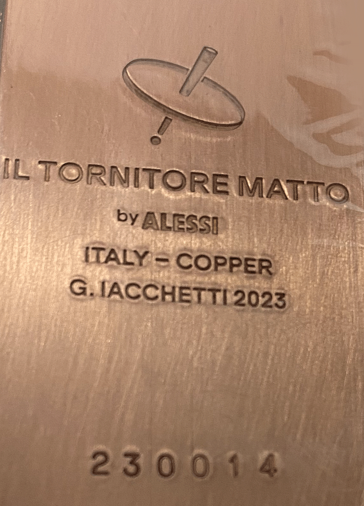 Detail of the engraved Il Tornitore Matto mark on the Conca Nr. 14 vase, new series by Alessi