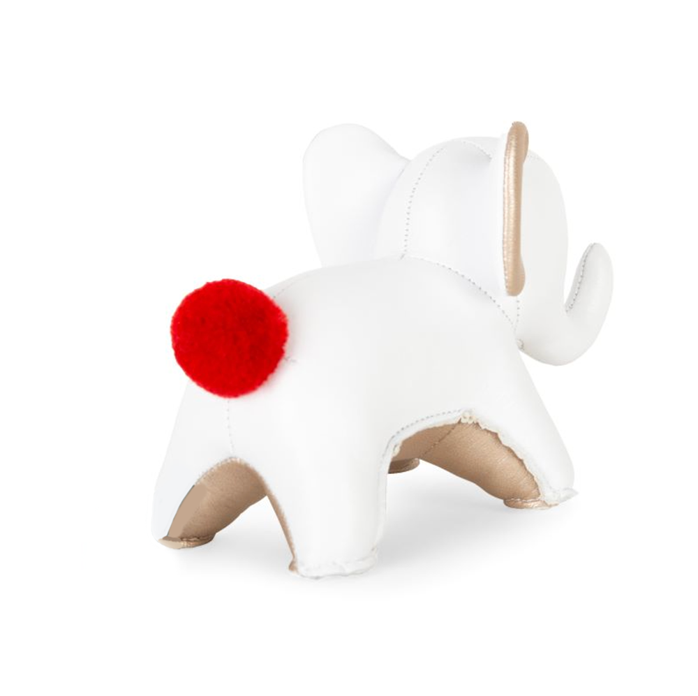 Zuny kleine olifant paperweight in wit, achteraanzicht met rode pompon