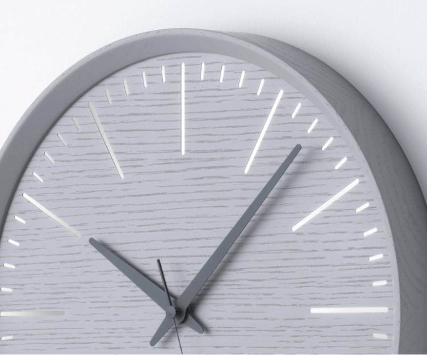 Detail of hands and index markers on the Lemnos Fluct wall clock in grey oak