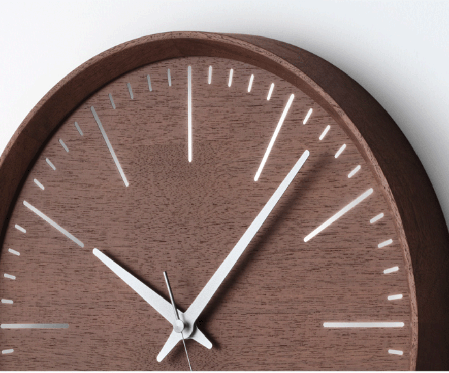 Detail of rim and dial of the Lemnos Fluct wall clock in walnut